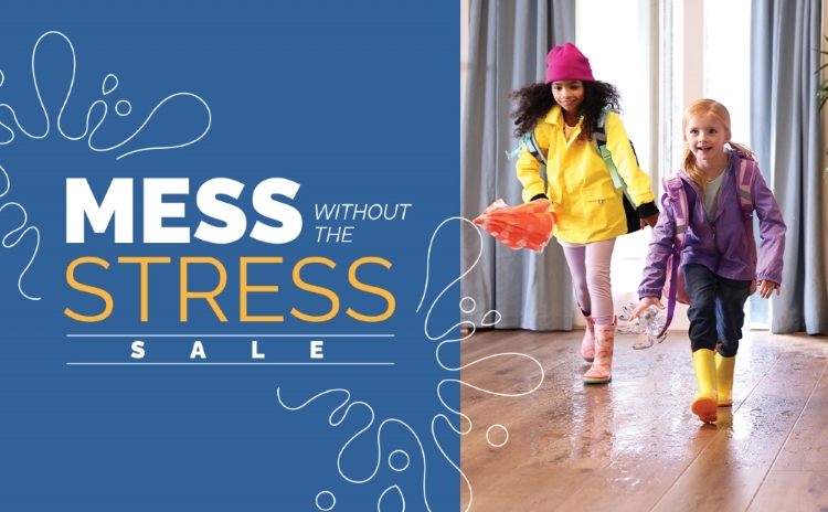 Siblings conducting a science volcano experiment on hardsurface flooring